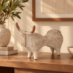 Cream Ceramic Bull Figurine with Red Horns