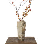 Weathered Stone Vase with Animal-Head Handle
