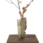 Weathered Stone Vase with Animal-Head Handle